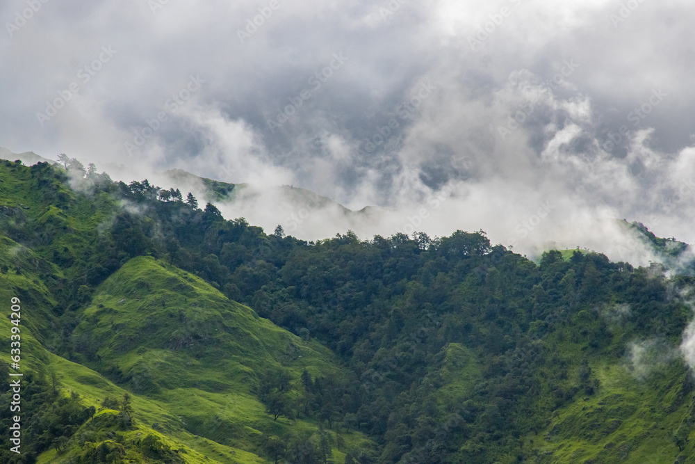 Breathtaking Green Landscape with Foggy Mountains and Waterfalls during Monsoon in Nepal