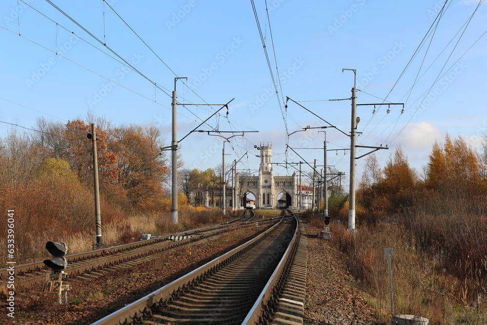 Old train station in Russia during autumn season. Beautiful architecture and clear sky.