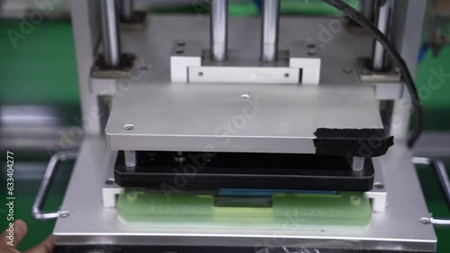 Screen pressing in a factory of smartphone production assembly line
