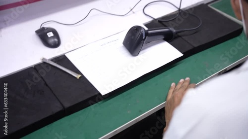 scanning smartphones stickers in smartphone production assembly line