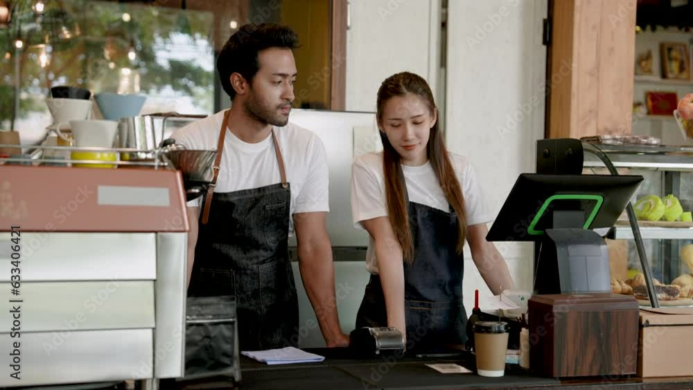 Portrait, Handsome young couple, beautiful Asian woman, Be owner cafe coffee shop here become full-fledged business, with passion for coffee cooking, this restaurant was created. Portrait, Handsome young couple, beautiful Asian woman, Be owner cafe coffee shop here become full-fledged business, with passion for coffee cooking, this restaurant was created.