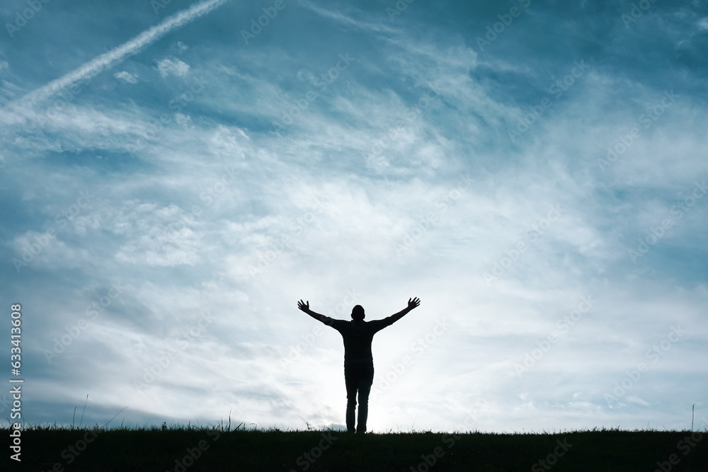 man silhouette feeling free among clouds in the mountain man silhouette feeling free among clouds in the mountain