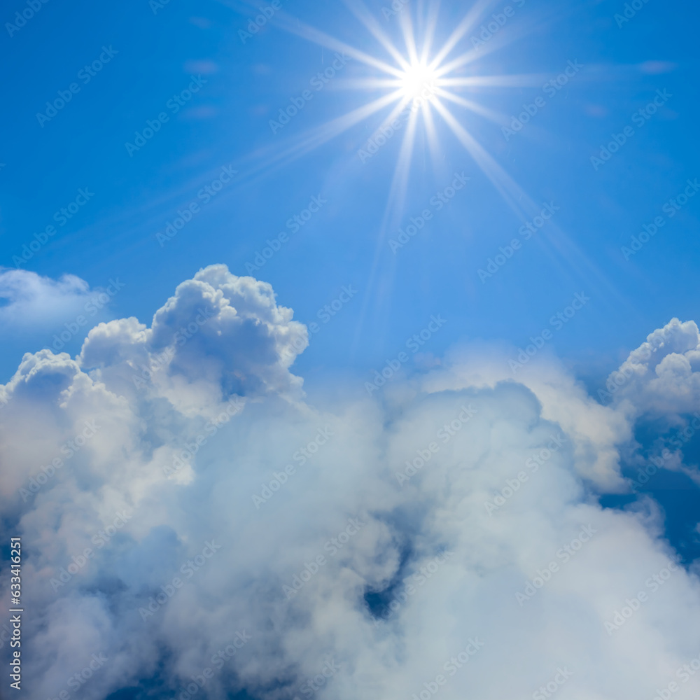 sparkle sun above a dense cumulus clouds
