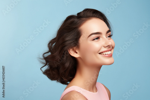 Generative AI portrait adorable young brunette girl flattering curly hair good mood fashion model isolated blue background