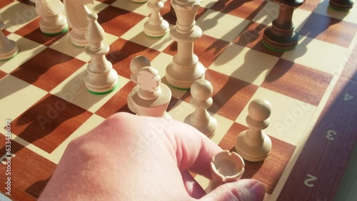 Short castling of the chess rook and king by the hand of the male player during the game, slow motion photo