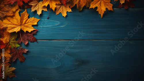 yellow autumn maple leaves on a dark turquoise wooden background with empty space to insert. Generative Ai.