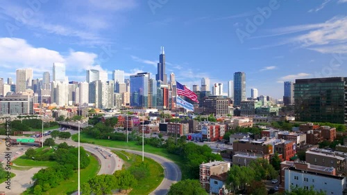 Aerial shot of Chicago downtown above the highway with American flag.