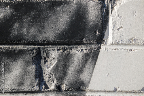 Painted brick wall. Dark part on the left side