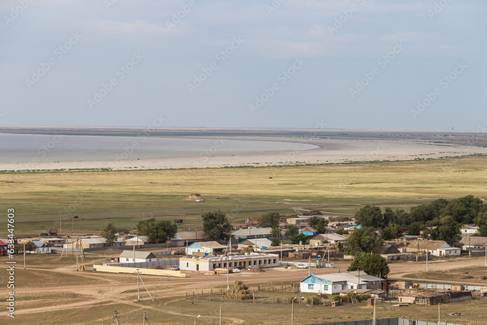 The village of Saryomir near Lake Shalkar in the West Kazakhstan region from a bird's eye view. A village (settlement) in Kazakhstan. The village of Saryomir near Lake Shalkar in the West Kazakhstan region from a bird's eye view. A village (settlement) in Kazakhstan.