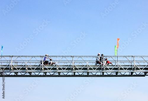 steel bridge with motorcycles in Vietnam