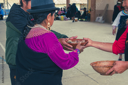 Saraguro culture sharing food at the annual Inti Raymi celebration photo
