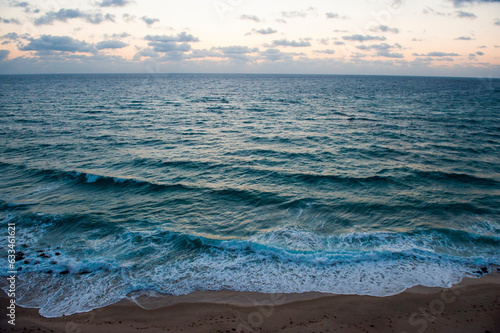 Surf rolls in at high tide; Palm Beach, Florida, United States of America