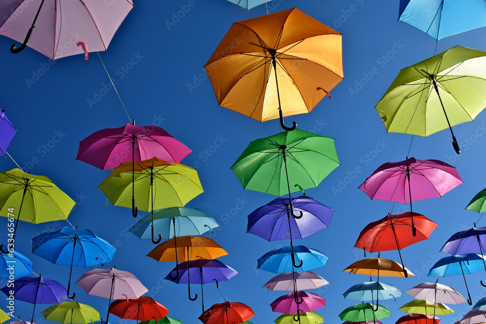 View up at backlit parasol canopy 