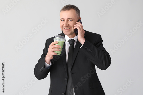 Mature businessman with gla...