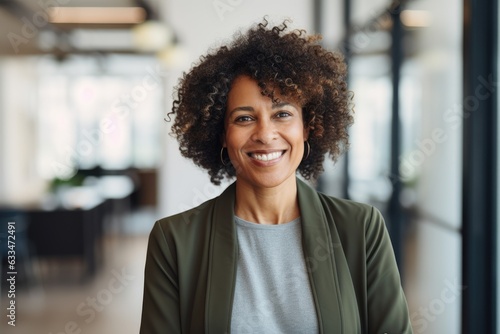 Middle aged african american business woman looking at camera in office