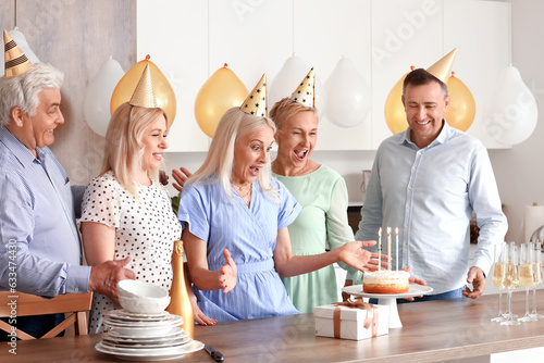 Mature people celebrating B...