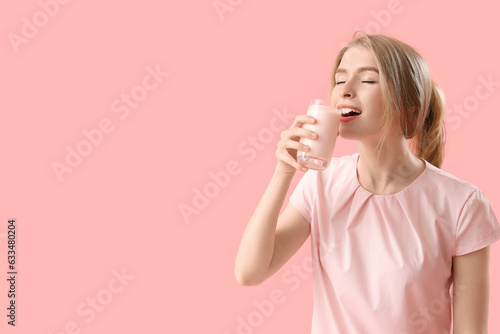 Young woman drinking tasty ...