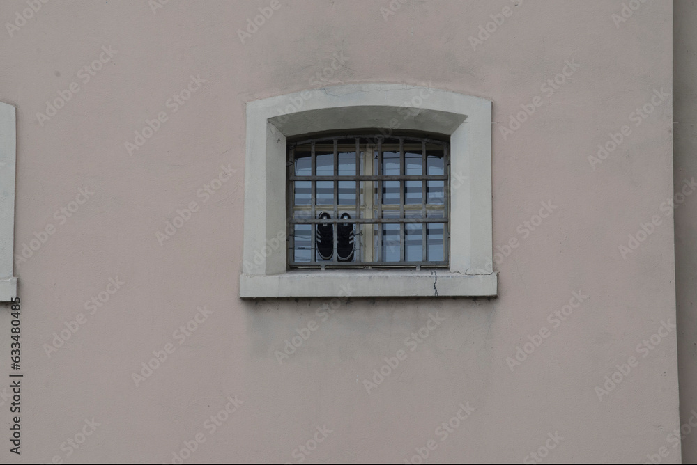 a prison window with bars