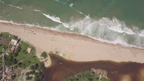 Imbassai Beach, Bahia. Aerial view. River meets sea waves
 photo