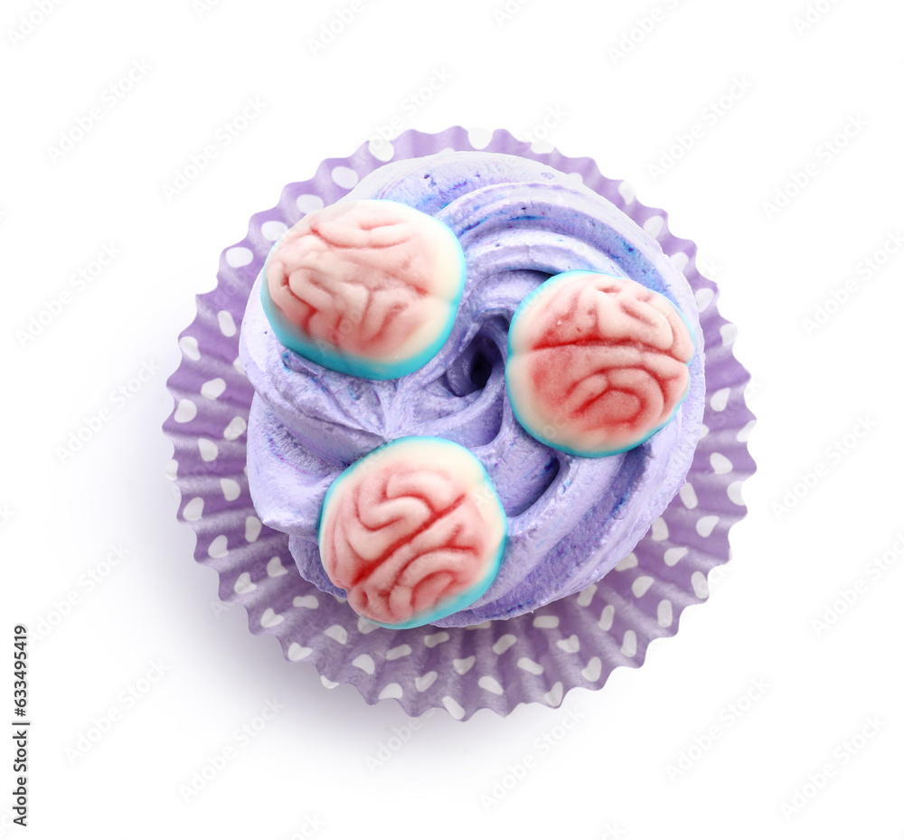 Delicious Halloween cupcake with candies on white background Delicious Halloween cupcake with candies on white background