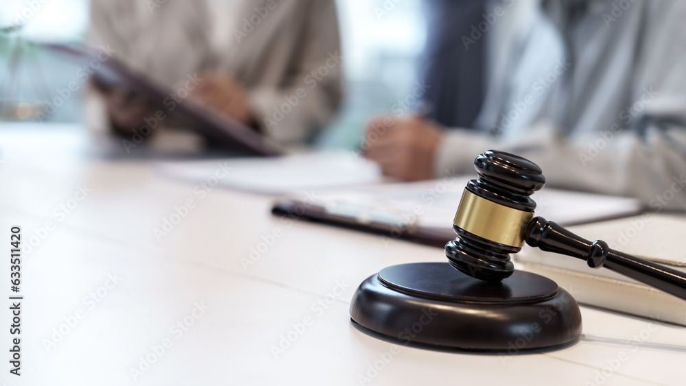 Lawyer with lawsuit meeting with client discussing with contract agreement at courtroom.. Lawyer with lawsuit meeting with client discussing with contract agreement at courtroom..