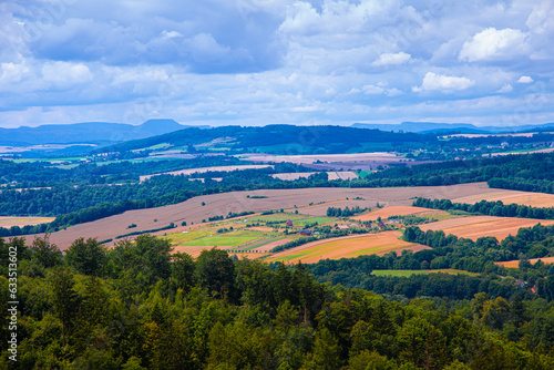 Beautiful landscape of fields. View from the mountain to the rural fields. summer day. © Olha Ye