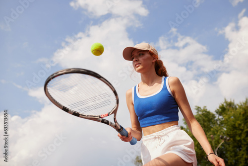 young sports girl playing tennis, active leisure, tennis training © st.kolesnikov