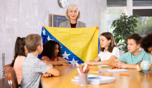 Kids learning together about bosnia in geography class photo