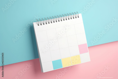 A lively image of a pink and yellow planner set against a vibrant bright blue background. Perfect for organization, creativity, and planning-themed visuals.