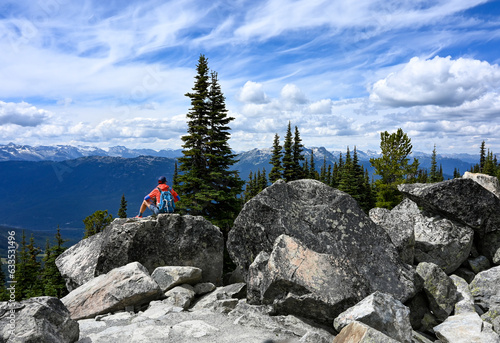 Hiker on rock in British Columbia Canada