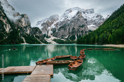Scenic view of boats tethered on floating pier at Lake Braies boathouse, Italy © A. Emson