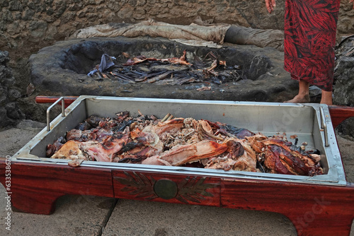 Pork cooked underground in the kalua tradition of Hawaii is shown just before being served as part of a luau meal in Hawaii.