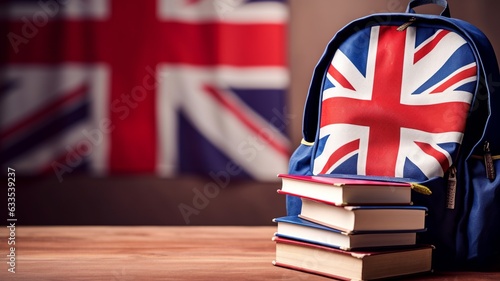 Tableau sur toile Student's backpack, books and the flag of Great Britain on the background