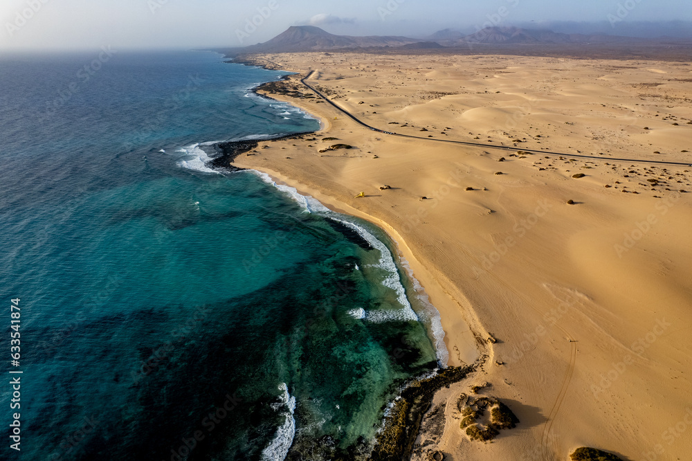 Landscape of Fuerteventura from drone, Yellow, sandy beach and blue water of atlantic ocean