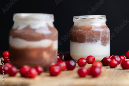 Yogurt with plum jam in a jar