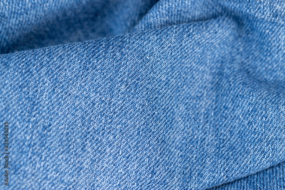 Naklejka premium close-up of a new blue denim fabric