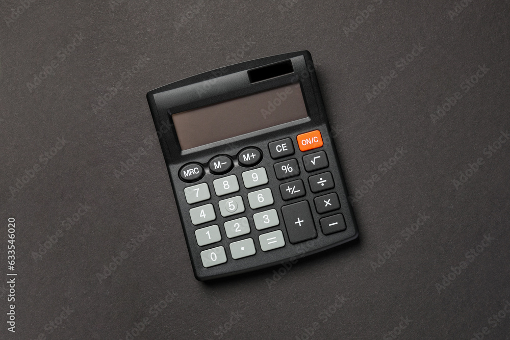 Calculator on black background, top view. Space for text Calculator on black background, top view. Space for text