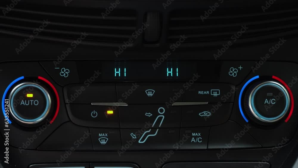 Finger turning off climate control toggle switch of car air conditioner, auto climate control in the car Finger turning off climate control toggle switch of car air conditioner, auto climate control in the car
