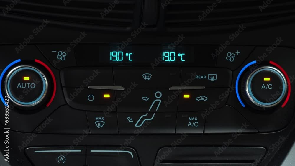 Finger presses button for turn on air recirculation mode in passenger