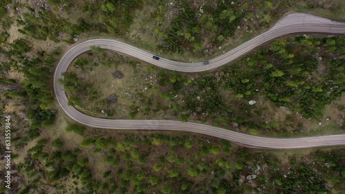 Top down view of cars as they traverse a winding road in the Black Hills