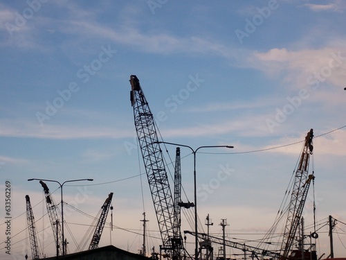 Boom Cranes at Sunda Kelapa Port photo