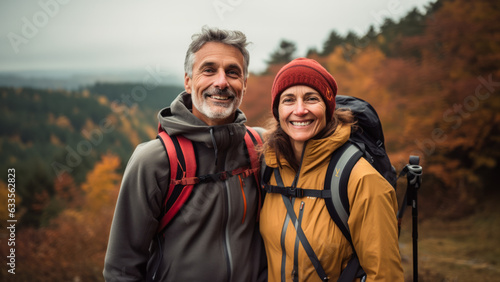 Middle aged couple hiking in the fall