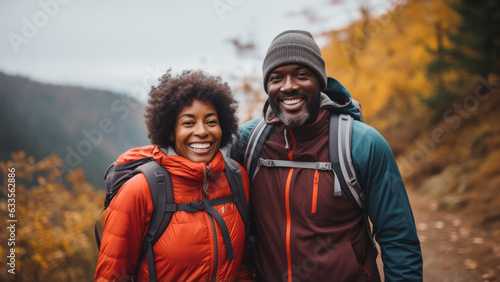 Middle age african-american couple hiking in the fall