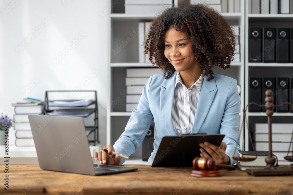 American woman is legal litigation attorney, Female lawyer is in a law firm drafting contracts and reading client case details to study and find a solution to win the case. Lawyer and justice concept. American woman is legal litigation attorney, Female lawyer is in a law firm drafting contracts and reading client case details to study and find a solution to win the case. Lawyer and justice concept.