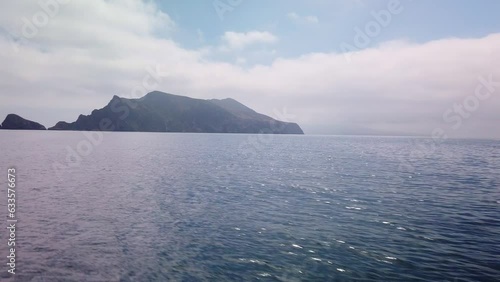 Gimbal panning shot approaching Anacapa Island by boat at the Channel Islands National Park off the coast of California. 4K photo