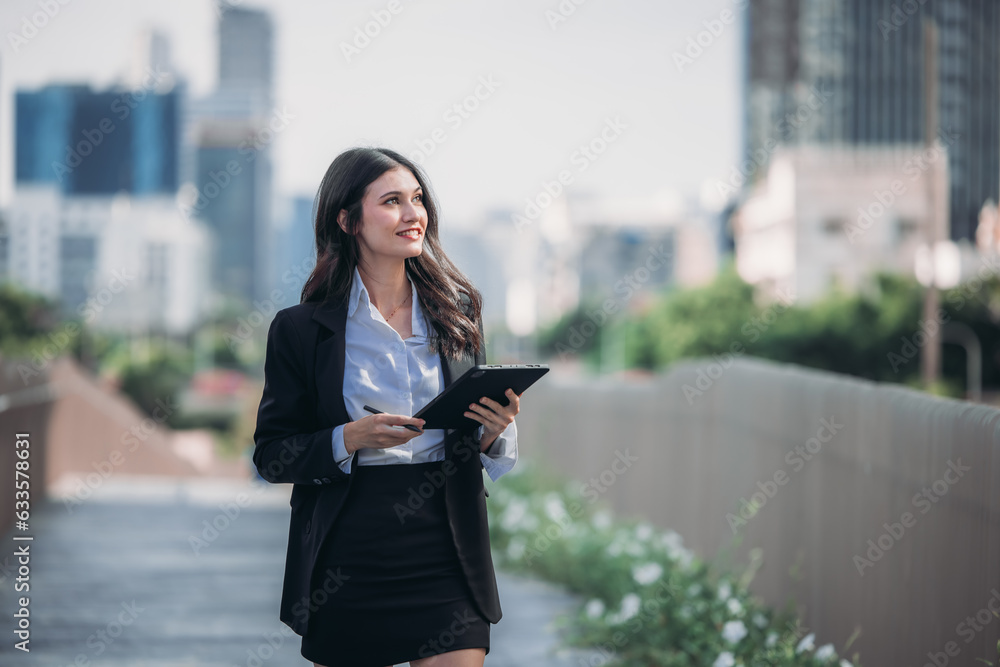Fototapeta premium Confident woman leads, showcasing exceptional leadership, strategic thinking, overseeing daily operations with her tablet.