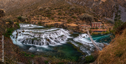 Emerald green waterfalls in the town of Huancaya, a very touristic place in the Sierra de Lima, Peru photo