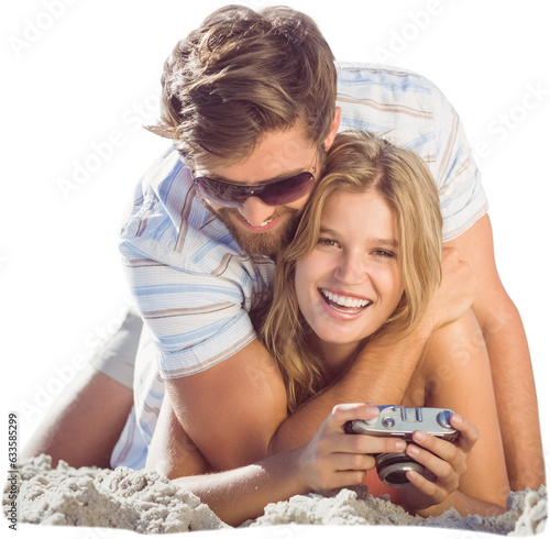 Digital png photo of caucasian couple with camera at beach on transparent background