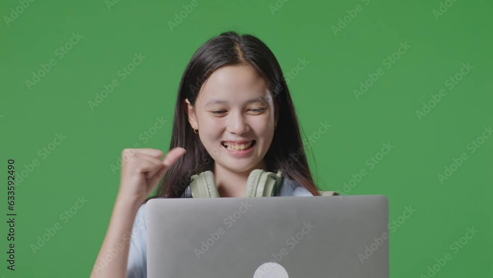 Close Up Of Asian Teen Girl Student With A Backpack Use Laptop And Celebrating While Standing In The Green Screen Background Studio
Close Up Of Asian Teen Girl Student With A Backpack Use Laptop And Celebrating While Standing In The Green Screen Background Studio