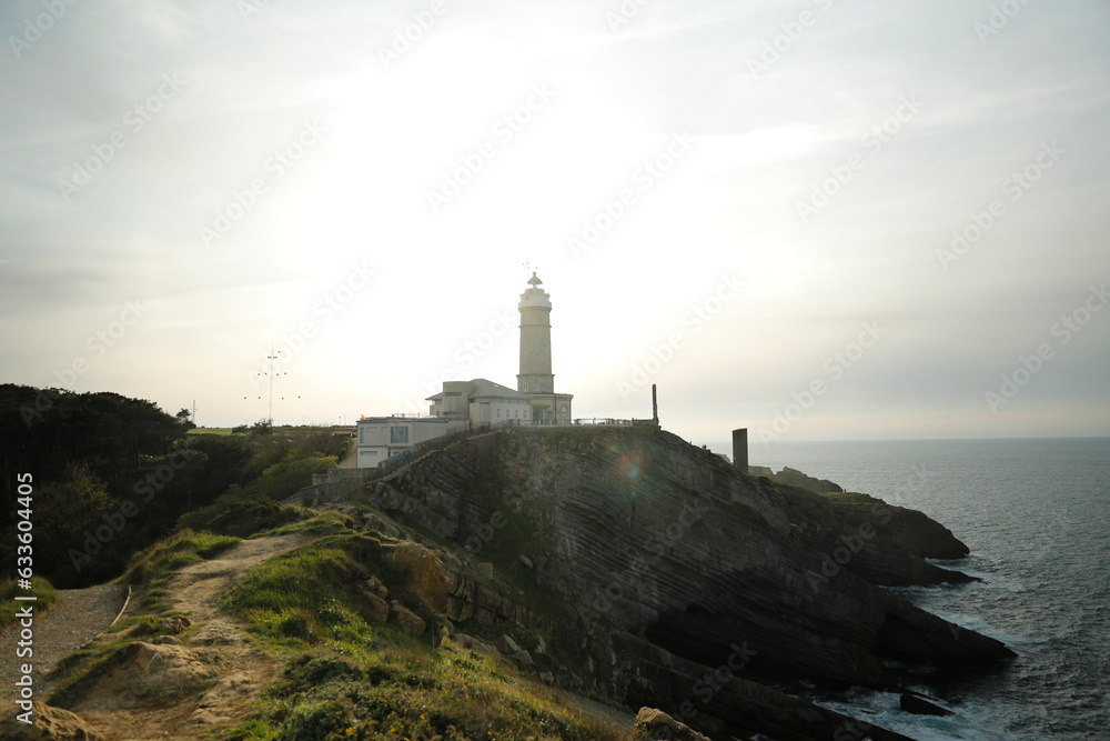 Lighthouse on top of a cliff by the sea. Santander, Cantabria, Spain